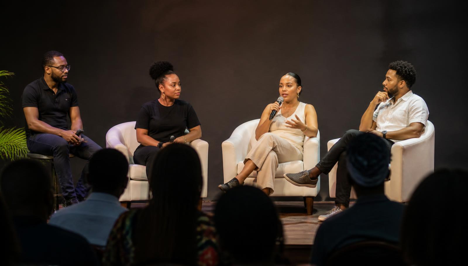 The TripX team on stage at a community event in Belize